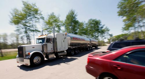 PHIL HOSSACK / WINNIPEG FREE PRESS - A transport truck hauling fuel pulls through the Pinegrove Rest Stop parking lot Tuesday afternoon as a steady stream of traffic pulled in to use the facilities. Pinegrove is popular with truckers due to easy access and egress for the large tractor trailers. - MAY 17, 2018.