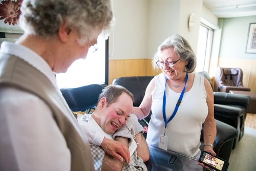 MIKAELA MACKENZIE / WINNIPEG FREE PRESS
Sister Irene Rioux (left), resident Jonathan Faircloth, and mother Doreen Draffin laugh together in the newly renovated St. Amant living space in Winnipeg on Wednesday, May 23, 2018.  Sister Rioux took care of Jonathan when he was little - Jonathan, who is not 42, wasn't expected to live past eight months.
Mikaela MacKenzie / Winnipeg Free Press 2018.