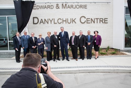 MIKE DEAL / WINNIPEG FREE PRESS
A group photo is taken with Edward and Marjorie Danylchuk, the Premier and other dignitaries during the grand opening of the new Emergency department, named the Edward and Marjorie Danylchuk Centre, at the Grace Hospital Thursday morning.  
180524 - Thursday, May 24, 2018.