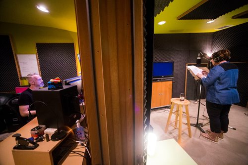 MIKAELA MACKENZIE / WINNIPEG FREE PRESS
Voice actor Monique LaCoste reads lines as voice director Nolan Balzer records in the studio at DACAPO Productions in Winnipeg on Thursday, May 24, 2018.  The team produced a soundscape for the Nonsuch exhibition that brings the scene to life.
Mikaela MacKenzie / Winnipeg Free Press 2018.