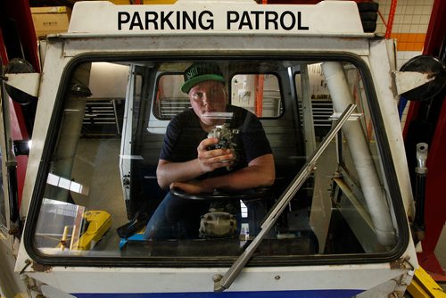 PHIL HOSSACK / WINNIPEG FREE PRESS - Grade 11 MITT automotive services student Mathieu Hrynchuk poses with a Cushman Truckster students are restoring at the trade school. The vehicles were originally used by "Meter Maids" by the city, and later parking commissionaires. See Bill Redekop's story. - May 24, 2018