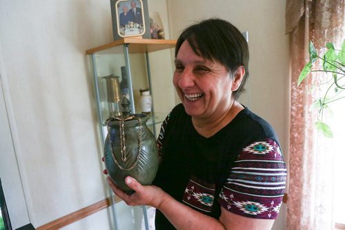 MIKE DEAL / WINNIPEG FREE PRESS
Linda Berard at her home near Portage La Prairie holds ashes while she talks about her daughter, Margaret Marie Berard, who recently died from an Oxi overdose.  
180524 - Thursday, May 24, 2018.