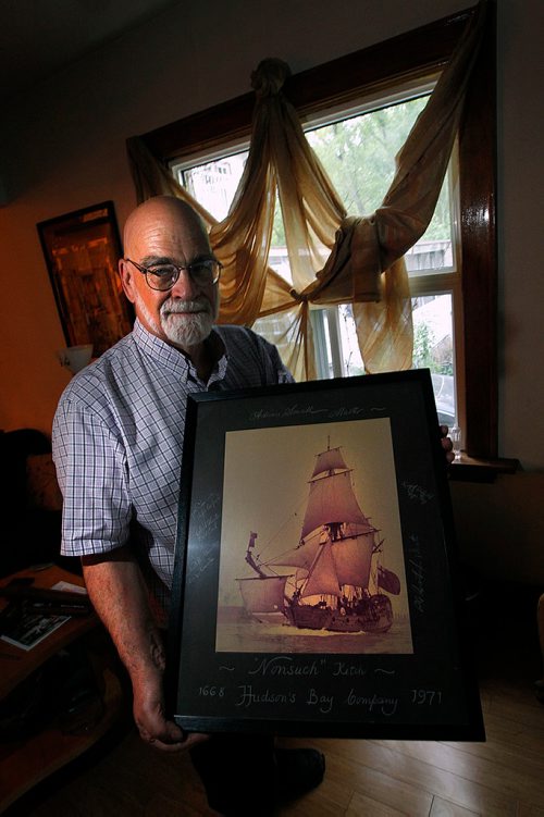 PHIL HOSSACK / WINNIPEG FREE PRESS - Sam Richards sailed on the Nonsuch in the 1970's. He poses in his home a favorite photo of the small tall ship featuring signatures of the crew around the matt. See Jill Wilson's story. - MAY 24, 2018.