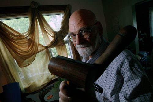 PHIL HOSSACK / WINNIPEG FREE PRESS - Sam Richards sailed on the Nonsuch in the 1970's. He poses in his home brandishing a mallet and belayiong pin from the small tall ship. See Jill Wilson's story. - MAY 24, 2018.