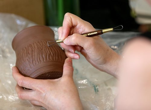 TREVOR HAGAN /  WINNIPEG FREE PRESS
Marim Daien Zipurksy, working on pottery at Clifton Coop during Doors Open Winnipeg. Saturday, May 26, 2018.