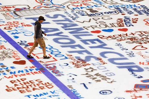 JOHN WOODS / WINNIPEG FREE PRESS
Justin St. Louis walks through the painted messages at Paint The Rink at the Winnipeg Jets' arena Sunday, May 27, 2018.
