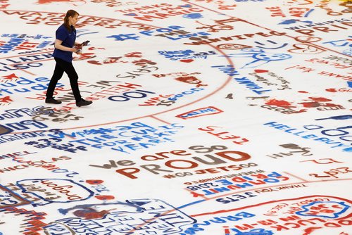 JOHN WOODS / WINNIPEG FREE PRESS
Someone walks through the painted messages at Paint The Rink at the Winnipeg Jets' arena Sunday, May 27, 2018.