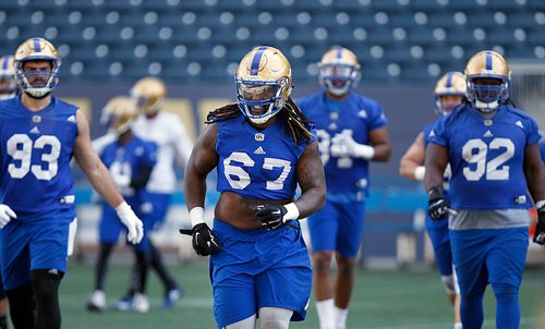 PHIL HOSSACK / WINNIPEG FREE PRESS - Bomber Cory Johnson #67 at a team workout Monday. Mike Sawatzsky story. - May 28, 2018