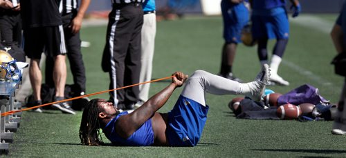 PHIL HOSSACK / WINNIPEG FREE PRESS - Bomber Cory Johnson works his abs at a team workout Monday. Mike Sawatzsky story. - May 28, 2018