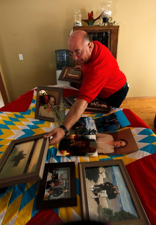 PHIL HOSSACK / WINNIPEG FREE PRESS -Kelly Gorzen spreads momentos of a life spent with his partner on a Star blanket presented to Tamy Boyce after her efforts as an EMO offecer with the Lake Manitoba First Nation after the 2011 flood. Tammy died in April. See Alex Paul story.  - May 28, 2018