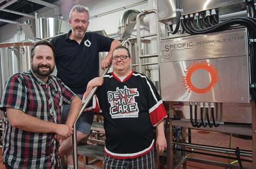 Canstar Community News May 23, 2018 - Colin Koop, Paul Clerkin, and Steve Gauthier have parnterned to share space at Stone Angel Brewing. Coop and Gauthier's new start up, Devil May Care, will be tenants at Stone Angel starting this June. (Danielle Da Silva/Canstar/Sou'wester)