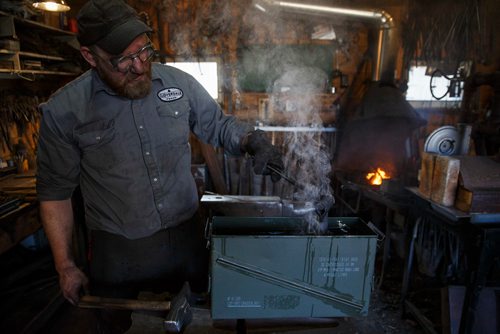 MIKE DEAL / WINNIPEG FREE PRESS
Matt Jenkins co-owner of Cloverdale Forge works on an axe head that will be on display at the Manitoba Museum in the newly renovated Nonsuch gallery.
180419 - Thursday, April 19, 2018.