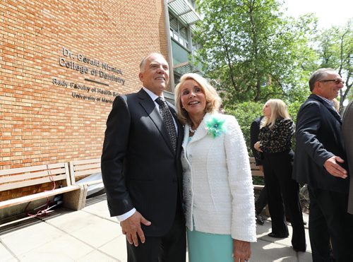 RUTH BONNEVILLE / WINNIPEG FREE PRESS


Photo of DR. GERALD AND MRS. REESA NIZNICK in front of the newly unveiled sign on the outside wall of the  College of Dentistry at the Rady Faculty of Health Sciences at the University of Manitoba Bannatyne Campus Tuesday.  A formal ceremony was held earlier in the atrium of the Brodie centre where it was announced that  Dr. Niznick  donated an historic $7.5 million of funding for the college before the unveiling. 

See Ashley Prest story.

May 29,  2018
