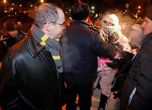 BORIS MINKEVICH / WINNIPEG FREE PRESS  090108 Protestors outside of the Asper Jewish Community Centre. A man walks away from conflict with protestor that police is trying to control.