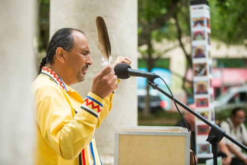 MIKAELA MACKENZIE / WINNIPEG FREE PRESS
David Budd performs a blessing before the gardens are planted at the Air Canada Park in Winnipeg on Wednesday, May 30, 2018.  The gardens showcase a variety of Indigenous plants, including sweet grass, lobelia, guara, Black-eyed Susan, wild strawberry, artemisia, and white cedar.
Mikaela MacKenzie / Winnipeg Free Press 2018.