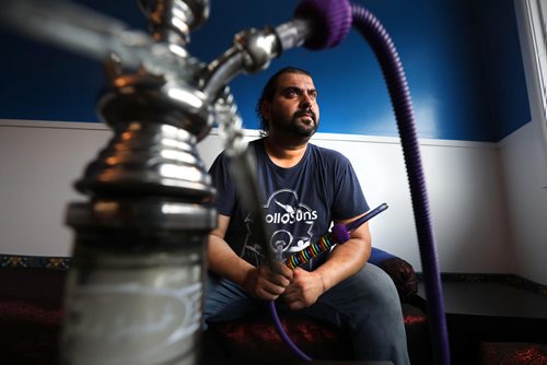 RUTH BONNEVILLE / WINNIPEG FREE PRESS


 
Ali Baba restaurant chef,  Sinan Aboud.

Portrait of  Sinan Aboud with his rainbow-coloured pipe he spotted in a shop Jordan when he was last there. He saw it and right away thought of getting it for Pride Week, which runs through Sunday.   His restaurant opened earlier this month and offers hookah pipes and 22 flavoured herbs to smoke. Its legal because of a gap in legislation.


 FOR SANDERS STORY 

May 30,  2018
