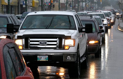 PHIL HOSSACK / WINNIPEG FREE PRESS -  STAND-UP - WHile reports of a flooded underpass at Main and Higgens weren't true, Main street southbound traffic was snarled and back up from Portage and Main right back past Selkirk ave and more in Wednesday afternoon's rush hour rain. - May 30 2018