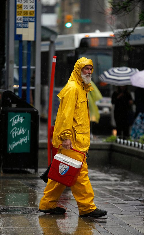 PHIL HOSSACK / WINNIPEG FREE PRESS -  STAND-UP-While many people were caught off guard by Wednesday afternoon's rush hour rain at least one downtown pedestrian came totally prepared.....shades of Captain Highliner..... - May 30 2018