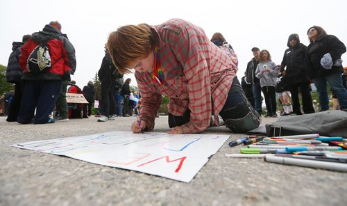 JOHN WOODS / WINNIPEG FREE PRESS
Jamie (no last name) makes a sign at a transgender rally and march at the Manitoba Legislature Saturday, June 2, 2018.