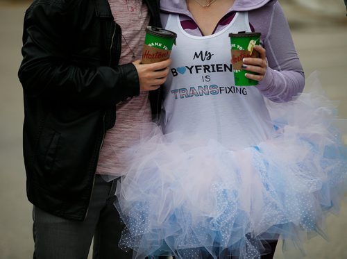 JOHN WOODS / WINNIPEG FREE PRESS
Jess Alexander and Alycia Mann use a creative means to get the message out at a transgender rally and march at the Manitoba Legislature Saturday, June 2, 2018.