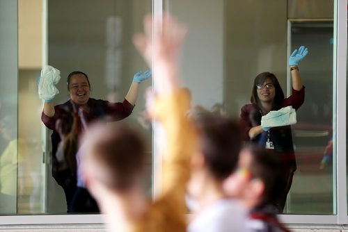 TREVOR HAGAN / WINNIPEG FREE PRESS
Window washers inside the convention centre watching the Pride Parade, Sunday, June 3, 2018.