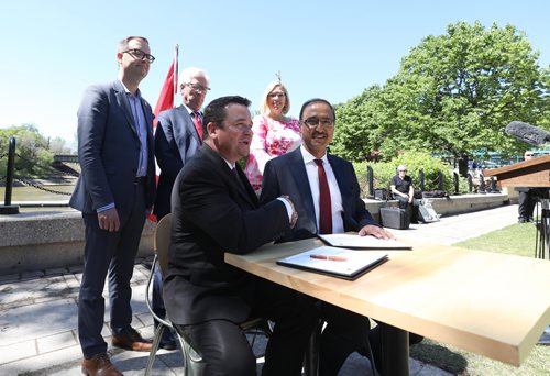 RUTH BONNEVILLE / WINNIPEG FREE PRESS


Infrastructure and Communities Minister Amarjeet Sohi (right) and Municipal Relations Minister Jeff Wharton sign documents for both governments to Invest in infrastructure programs at the Forks Monday.  
Also at presser were AMM president, Chris Goertzen,  MLA Rochelle Squires  and MP Jim Carr.

See story

June 4,  2018
