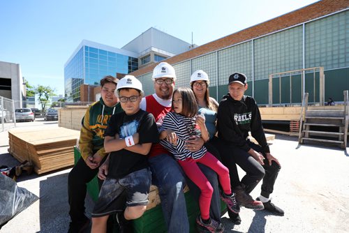 RUTH BONNEVILLE / WINNIPEG FREE PRESS


Kick-off for the Rady Faculty of Health Sciences & Habitat for Humanity Manitoba
??Build project.  

Craig Beaulieu and his family; partner, Leeann Dumas, and their 4 kids, from left, Quinton (14yrs), Tierra (6yrs), Jordan (15yrs) and Eric (11yrs), pose for a quick family photo on a stack of lumber next to what will be their new home Monday morning.  The couple will build their own home alongside health professionals, researchers and students thanks to a continued partnership between the University of Manitobas Rady Faculty of Health Sciences and Habitat for Humanity Manitoba.  A parking lot near the  Bannatyne Campus is the site of the 10-day build running June 4  15, 2018.
 

See Alex Paul Story. 
June 4,  2018
