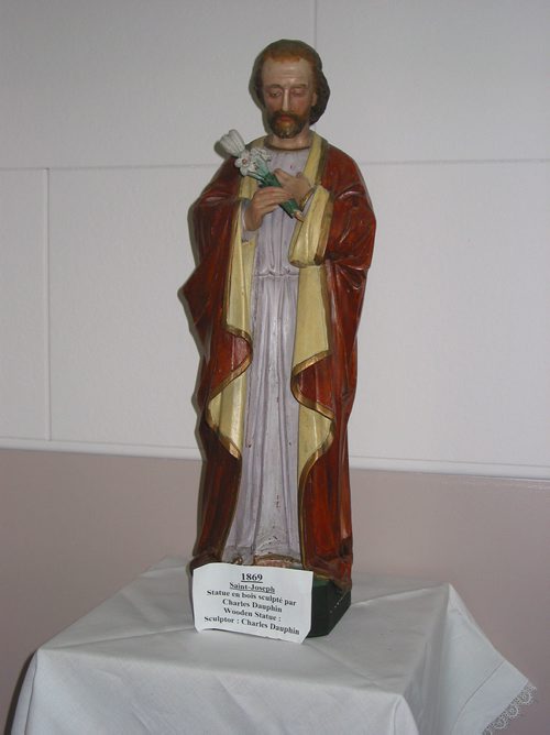 Canstar Community News May 23, 2018 - A wooden statue of Saint Joseph carved by famous sculptor Charles Dauphin in 1869 is displayed in the St. Francois Xavier Roman Chatolic Church. (ANDREA GEARY/CANSTAR COMMUNITY NEWS)