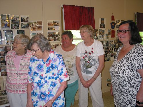 Canstar Community News May 29, 2018 - (From left) St. Charles United Church members Pat Dalton, Mabel Hedges, Betty Walker and Donna Thompson and minister Joanne Kury look at photos showing the church;s history from 1922 to the present day. The church is hosting an open house on June 16 from 1 to 4 p.m. prior to its closing. (ANDREA GEARY/CANSTAR COMMUNITY NEWS)