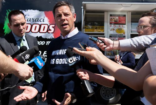 ANDREW RYAN / WINNIPEG FREE PRESS Winnipeg Mayor Brian Bowman speaks to press after trying the Pizza Pops recipe as originally made by the late Paul Faraci on June 5, 2018. Faraci's nephew Phil and his son Anthony decided to remake the recipe after its originator passed in February.