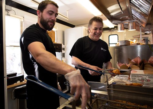ANDREW RYAN / WINNIPEG FREE PRESS Anthony, left, and Phil Faraci cook the first Pizza Pops recipe as originally made by the late Paul Faraci on June 5, 2018. Phil, and his son, decided to remake the recipe after its originator, their uncle passed in February.