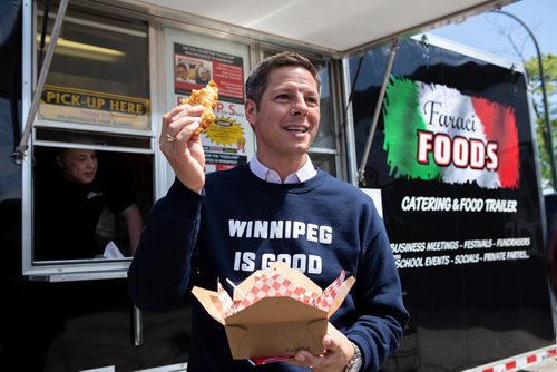 ANDREW RYAN / WINNIPEG FREE PRESS Winnipeg Mayor Brian Bowman tries the Pizza Pops recipe as originally made by the late Paul Faraci on June 5, 2018. Faraci's nephew Phil and his son Anthony decided to remake the recipe after its originator passed in February.