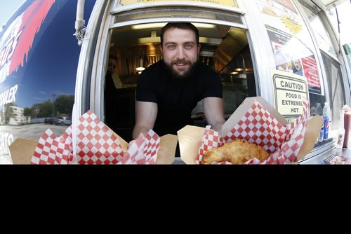 Anthony Faraci in his food truck as he relaunches his late uncle Paul Faraci's original Pizza Pop - Paul's Original Pizza Snack (POPS) in Winnipeg, Tuesday, June 5, 2018.  THE CANADIAN PRESS/John Woods