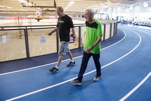 MIKE DEAL / WINNIPEG FREE PRESS
Lou Billinkoff warms up with his trainer Sheldon Reynolds (in black) before he runs the 50 meter dash, which he completed in 14.45 seconds on his 95th birthday at the Canada Games Sport for Life Centre while training for a 100m sprint at the end of June.
180605 - Tuesday, June 05, 2018.