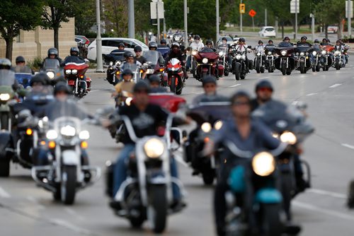 JOHN WOODS / WINNIPEG FREE PRESS
Family, friends and supporters ride across the Provencher Bridge and gathered at the corner of Portage and Home Tuesday, June 5, 2018 to remember Robert Benson, aka Matt Cave, who was killed in a motorcycle collision with a stolen van.