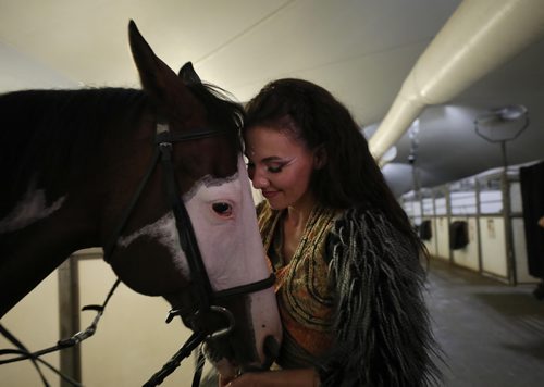 RUTH BONNEVILLE / WINNIPEG FREE PRESS

Cavalia Odysseo

Feature on Day in the life of a professional rider and her horse.  Photos shadowing  a Odysseo rider, Chelsea Jordan, and her horse Utah (brown) and other horses as they get ready for the show   prepping for the performance, makeup, hair, costume, rehearsals, pre-show rituals with rider/horse, some shots of show during water scene and  post-show wind down, shower, groom and treat time. 
Photos taken on May 31, 2018.
Chelsea enjoys spending time with her favourite horse, Utah washing him after the show. 

See Erin Lebar story
June 5,  2018
