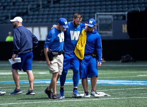 ANDREW RYAN / WINNIPEG FREE PRESS Winnipeg Blue Bombers Quarterback Matt Nichols comes off of the field after an injury during practice on June 6, 2018.