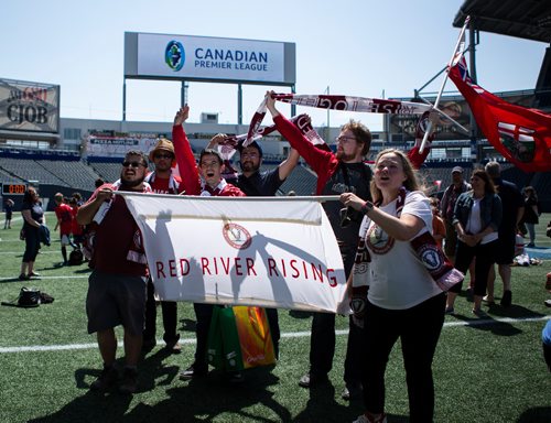 ANDREW RYAN / WINNIPEG FREE PRESS Members of the Winnipeg Valour FC support group Red River Rising celebrate upon arriving at the unveiling of the team's logo at the Investor Group field on June 6, 2018.