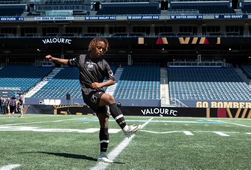 ANDREW RYAN / WINNIPEG FREE PRESS Twelve year old striker, Jaxen Neufeld kicks around a ball after the unveiling of Winnipeg's new Canadian Premeire League team Valour FC on June 6, 2018.