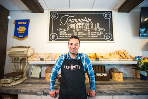 MIKAELA MACKENZIE / WINNIPEG FREE PRESS
Jean-Marc Champagne, co-owner of Fromagerie Bothwell, poses in the shop in Winnipeg on Wednesday, June 6, 2018. It's the first Bothwell shop in Winnipeg and besides cheese, it's stocked with all kinds of made-in-Manitoba products.
Mikaela MacKenzie / Winnipeg Free Press 2018.