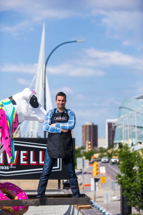 MIKAELA MACKENZIE / WINNIPEG FREE PRESS
Jean-Marc Champagne, co-owner of Fromagerie Bothwell, poses on the roof of the shop in Winnipeg on Wednesday, June 6, 2018. It's the first Bothwell shop in Winnipeg and besides cheese, it's stocked with all kinds of made-in-Manitoba products.
Mikaela MacKenzie / Winnipeg Free Press 2018.