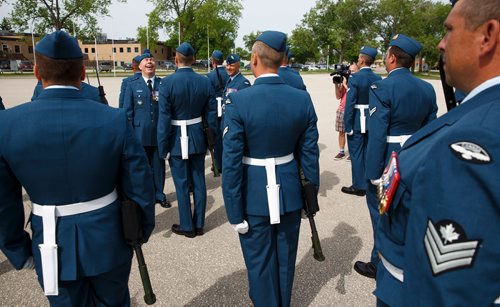 MIKE DEAL / WINNIPEG FREE PRESS
Brigadier-General Sean Boyle, Deputy Commander 1 Canadian Air Division laughs during his review the contingent of the RCAF during one of their final practices at 17 Wing Winnipeg before heading to London to perform Public Duties for Her Majesty Queen Elizabeth II from June 25th to July 15th.
180608 - Friday, June 08, 2018.