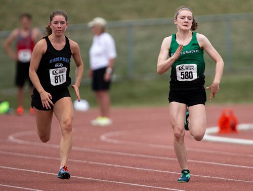 ANDREW RYAN / WINNIPEG FREE PRESS Reese Lange and Abby Bestland compete during the MHSAA championship junior varsity 100 metre sprint on June 8, 2018. Lange, a student at Murdoch Mackay high school won the event.