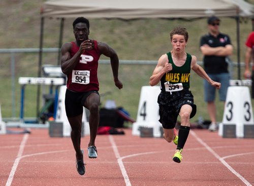ANDREW RYAN / WINNIPEG FREE PRESS Jordan Soufi, right, and Matt Indome sprint during the varsity 100 metre sprint during the MHSAA track and field event on June 8, 2018. After Indome stumbled off of the line, Soufi, from Miles Macdonell high school finished first.