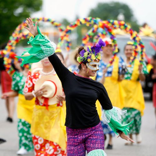 PHIL HOSSACK / WINNIPEG FREE PRESS -  STAND-UP - Dancers and Filippino women in traditional dress make their way through the Maples as the Manitoba Filippino Street Festival paraded it's way to the Maples Multiplex where celebratiuons ensued. - June 9, 2018