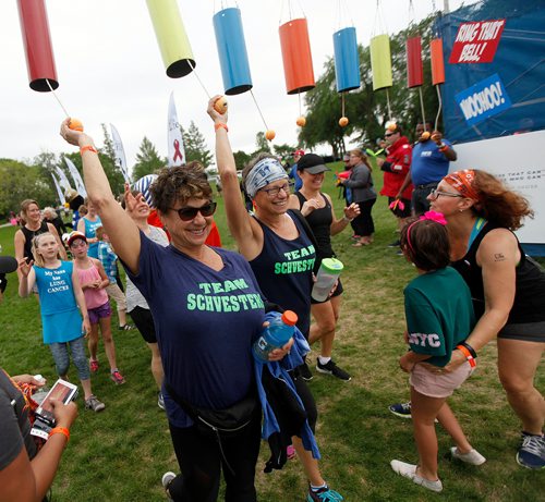 PHIL HOSSACK / WINNIPEG FREE PRESS -  Finishers celebrate their walk by ringing bells at the finish line Saturday afterooon at the Challenge for Life  walk in support of Cancer Care. See Ashley Prest story. - June 9, 2018