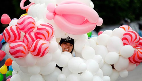 PHIL HOSSACK / WINNIPEG FREE PRESS -  STAND-UP - Buried within her ballon costume, Allaine Deuna dances her way through the Maples as the Manitoba Filippino Street Festival paraded it's way to the Maples Multiplex where celebratiuons ensued. - June 9, 2018