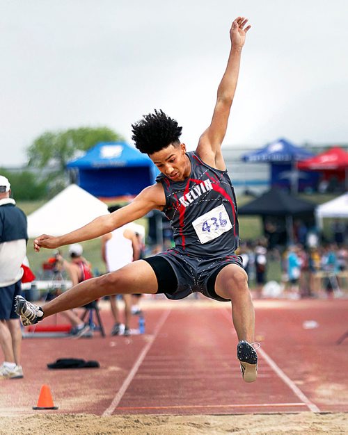 PHIL HOSSACK / WINNIPEG FREE PRESS - Kelvin Collegiate's decathlete Cyrus Kyle leaps into a long jump in competition Saturday afternoon. See Taylor Allen's story.- June 9, 2018