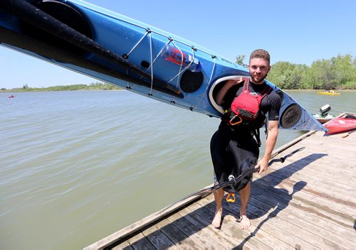TREVOR HAGAN / WINNIPEG FREE PRESS
Alex Martin, 18, here at FortWhyte during the MEC Paddlefest, will be attempting a solo kayak trip around Lake Winnipeg later this summer, Sunday, June 10, 2018.
