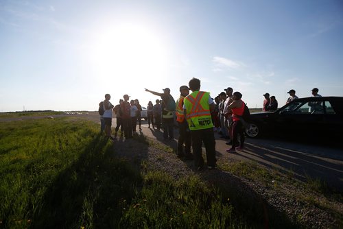 JOHN WOODS / WINNIPEG FREE PRESS
Volunteers gather to search for Eduardo Balaquit in a field just outside the perimeter highway in Winnipeg Sunday, June 10, 2017.

